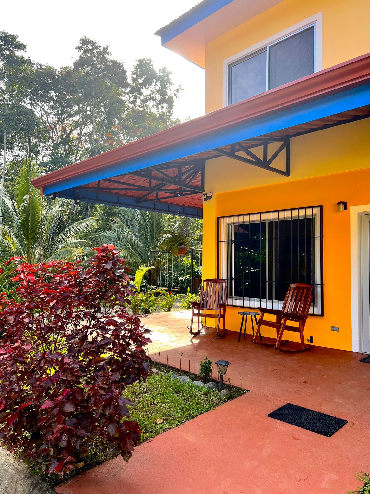 Cocles Villa's facade under the palms
